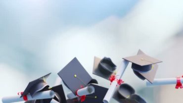 graduation caps tossed into the air