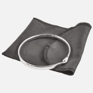 Carrs Solid Twist Sterling Silver Bracelet for women on grey fabric sleeve.